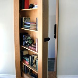 Bookshelf Door in Light Stain Halfway Open