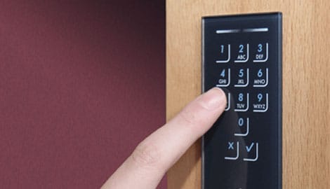 Wireless keypad for opening a hidden door