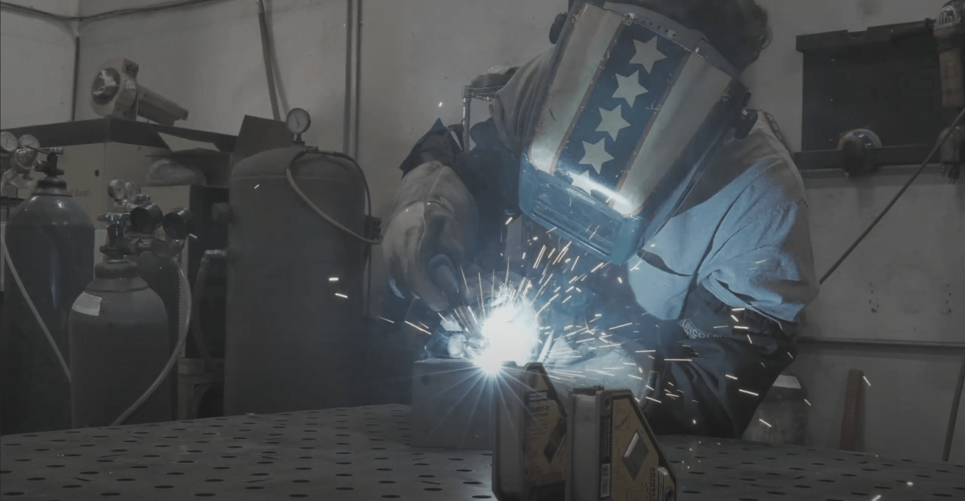 a man welding metal parts